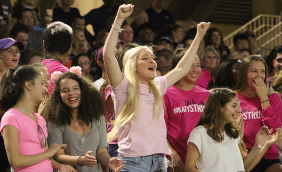 Senior, Avery Dishaw, shows her Spartan pride as she cheers on the varsity football team. Although the Spartans faced defeat, encouragement was appreciated. 