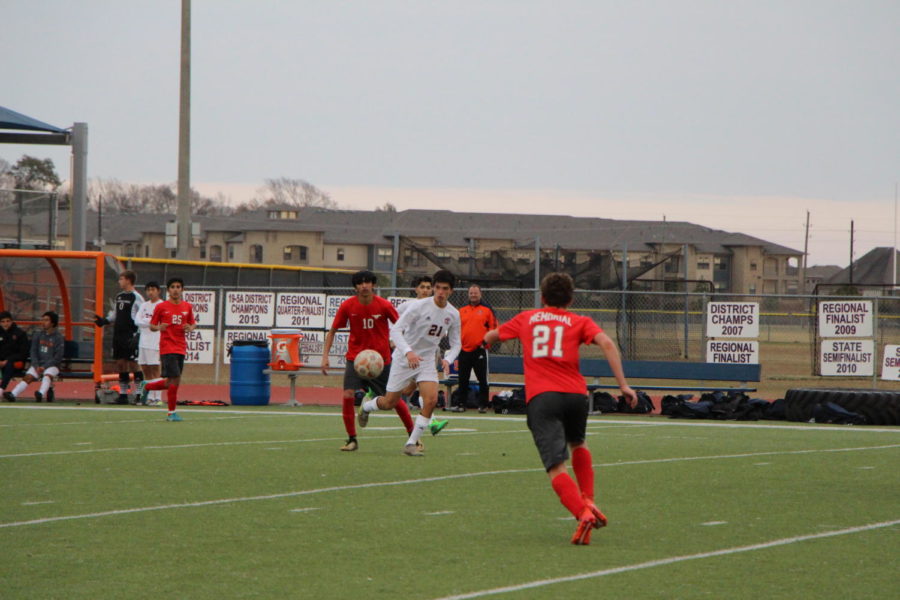 Carlos Ortiz-Ramirez moves away from a memorial player.