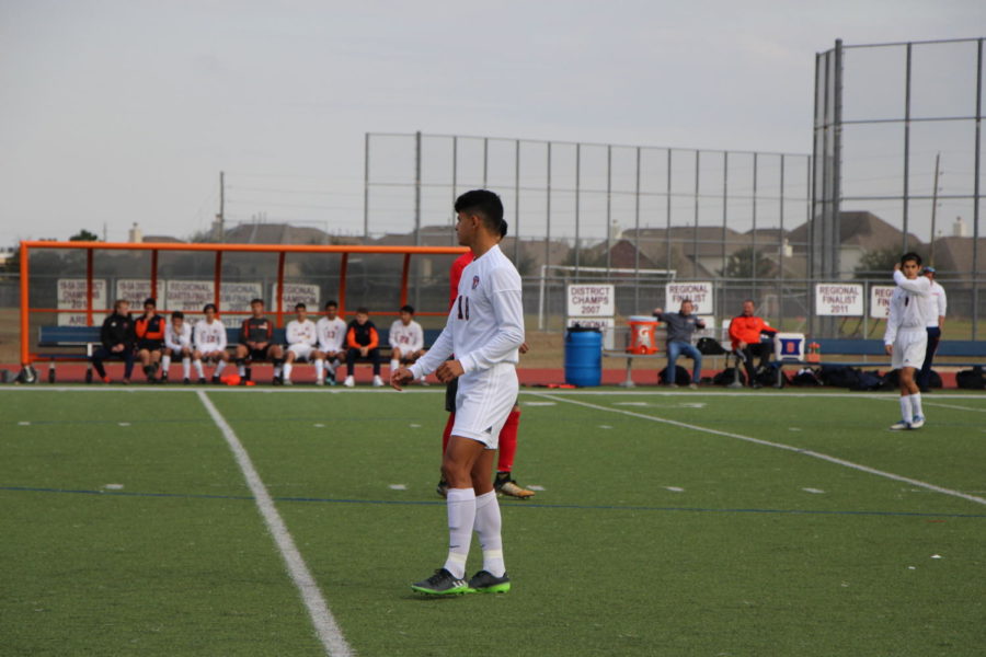 Alejandro Suarez stands on looking the action.