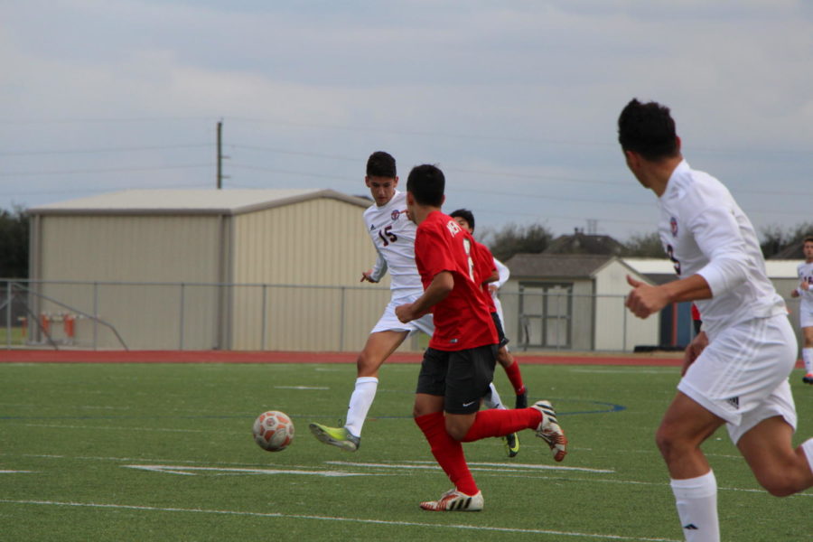 Felipe Ordonez moves between opponents on his way across the field.